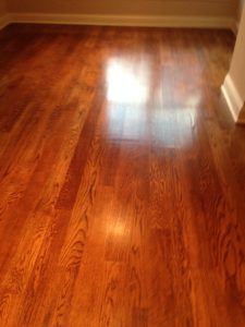 Clean and shiny hardwood floor after being cleaned