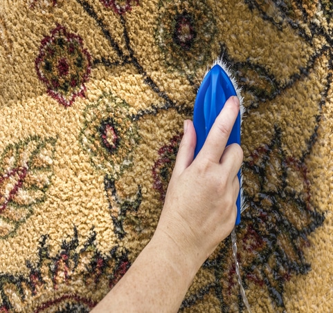 Knotted rug cleaned by hand.